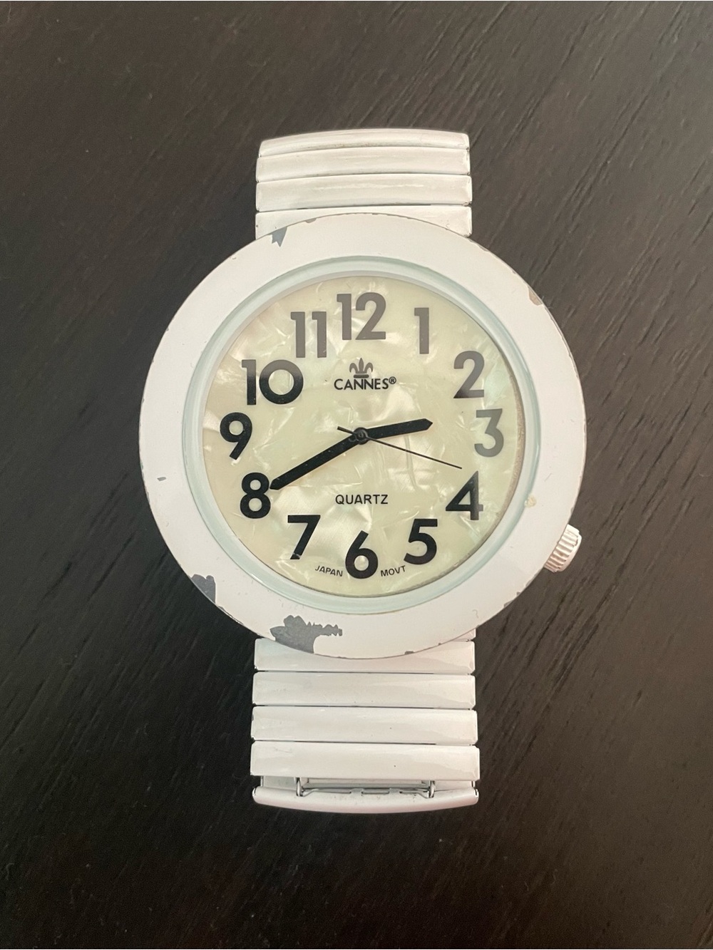 Cannes White Round Face Quartz Watch with iridescent face and black writing